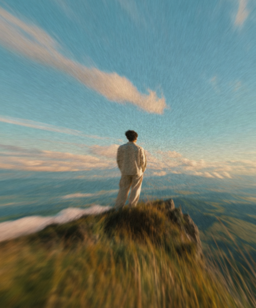 Person overlooking a wide landscape and sky
